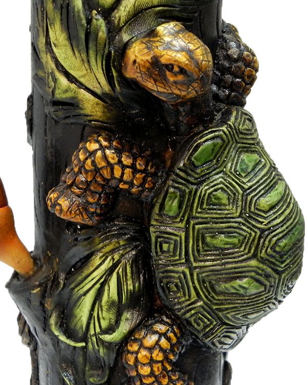 Handcrafted tobacco smoking water pipe of a green and brown turtle with leaves and a twisted brown tree.