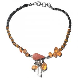 Handmade hematite and seed bead alpaca silver metal chain anklet with teardrop-cut orange jasper stone cabochon, natural clear quartz crystal point, chip stones, and metal dangles in orange color.
