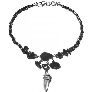 Handmade hematite and seed bead alpaca silver metal chain anklet with teardrop-cut black onyx stone cabochon, natural clear quartz crystal point, chip stones, and metal dangles in black color.