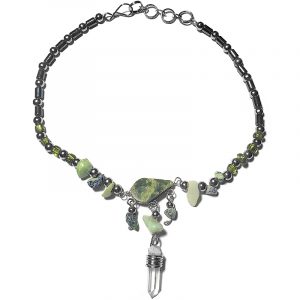 Handmade hematite and seed bead alpaca silver metal chain anklet with teardrop-cut olive green serpentine stone cabochon, natural clear quartz crystal point, chip stones, and metal dangles in lime green color.