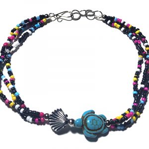 Handmade multicolored seed bead multi strand anklet with seashell bead and sea turtle shaped tumbled magnesite gemstone crystal centerpiece in black, silver, turquoise blue, dark pink, yellow, white, and light blue color combination.
