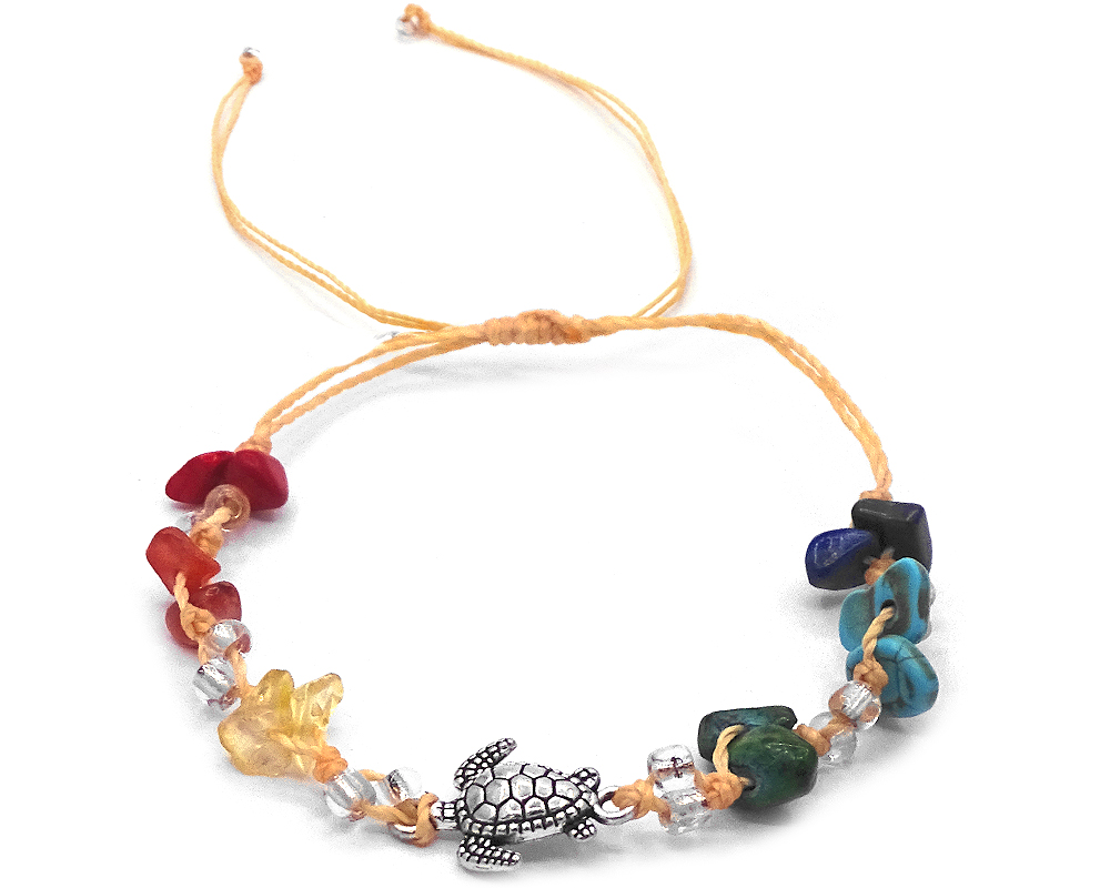Handmade tied string pull tie anklet with rainbow colored chip stones, seed beads, and silver metal sea turtle charm in beige color.