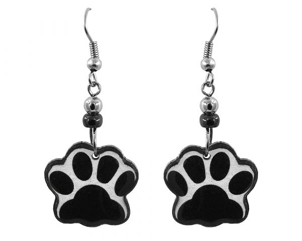 Handmade paw print acrylic dangle earrings with beaded metal hooks in black and white color combination.