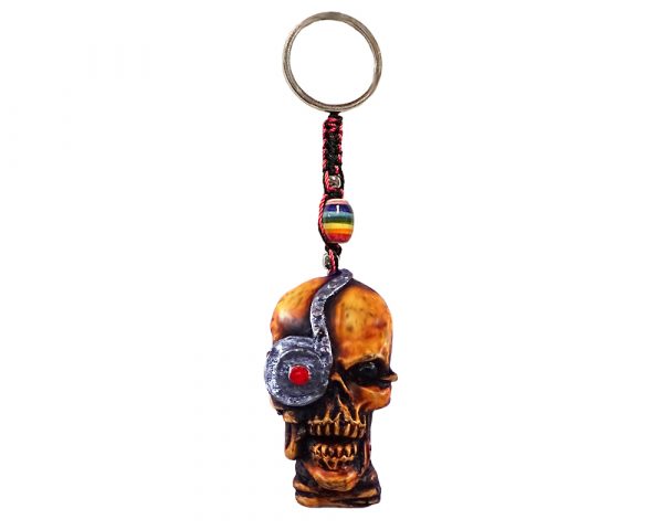 Handmade durepox resin figurine keychain of a cyborg skull with a robot eye.