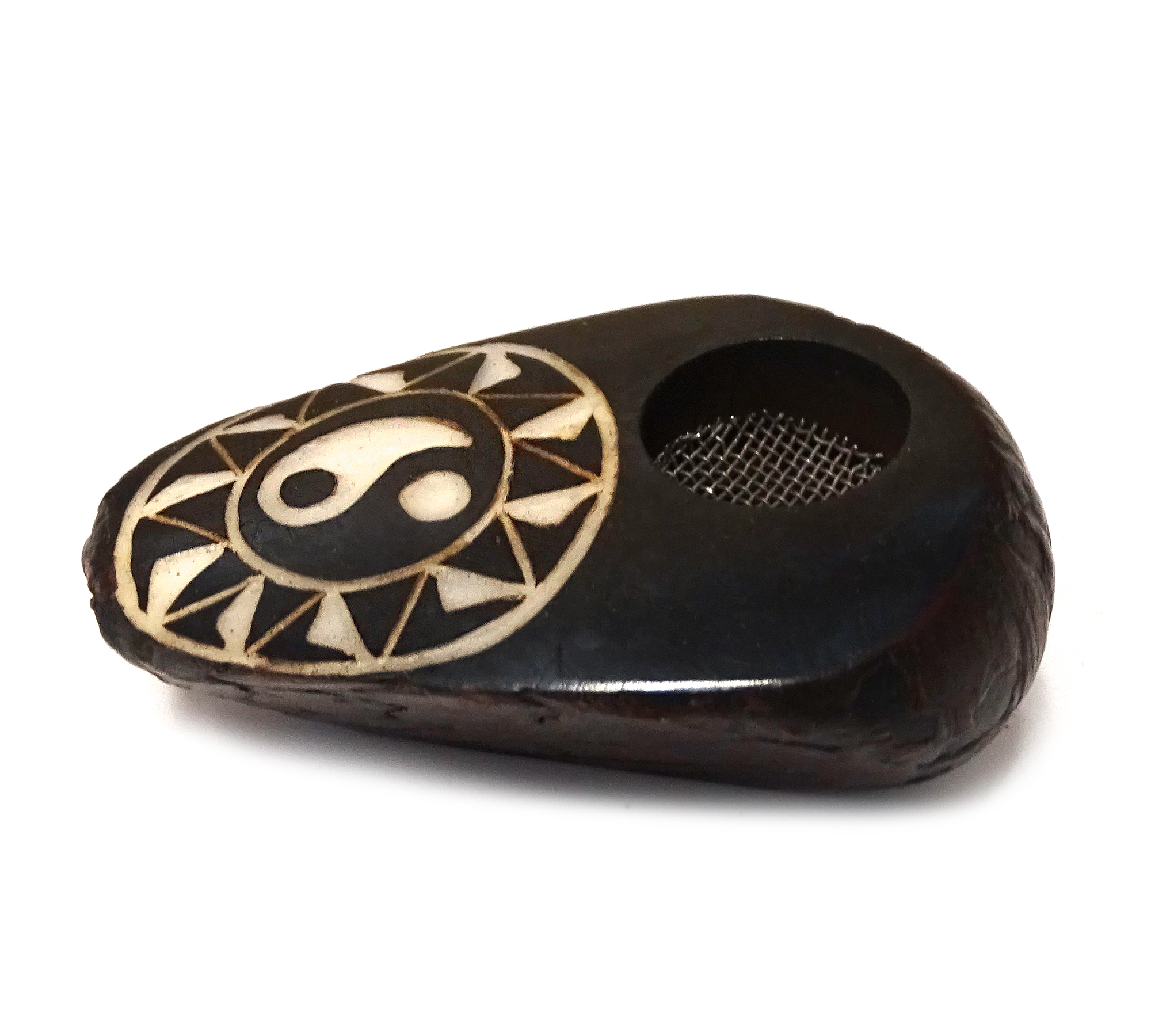 Handcarved tobacco smoking mini round natural tagua nut hand pipe bowl of a yin yang symbol inside of a tribal sun design.