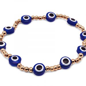 Handmade evil eye bead and seed bead stretchy bracelet in blue, gold, black, and white color combination.