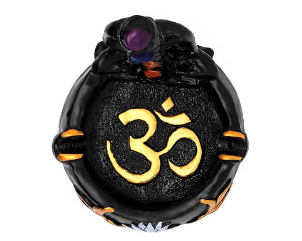 Handcrafted round incense holder ash tray with a gold om sign, lotus design, and a black 3D figurine of a meditating body with 7 chakra rainbow-colored tumbled gemstone crystals.