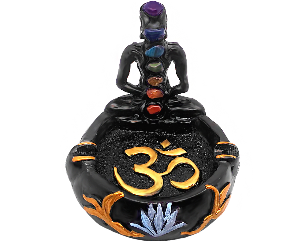 Handcrafted round incense holder ash tray with a gold om sign, lotus design, and a black 3D figurine of a meditating body with 7 chakra rainbow-colored tumbled gemstone crystals.