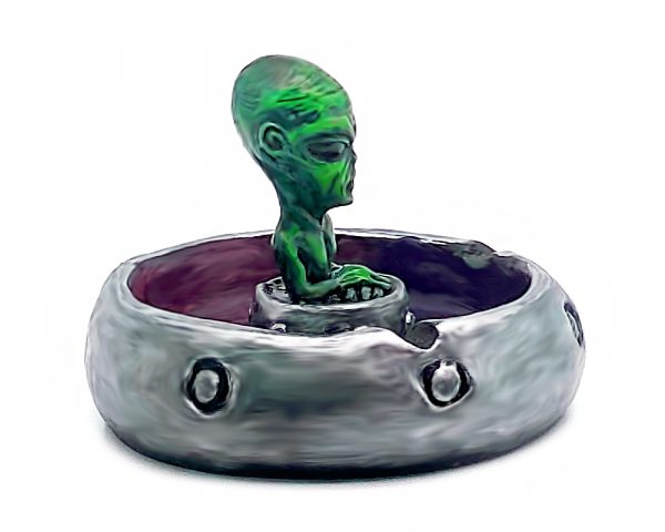 Handcrafted round incense holder ash tray in a flying saucer shape with a galaxy design and a 3D figurine of an alien in green, silver, dark purple, red, white, and black color combination.