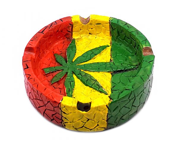Handcrafted round-shaped flat incense holder ash tray with Rasta-colored mosaic tile design and cannabis pot leaf in green, yellow, and red color combination.