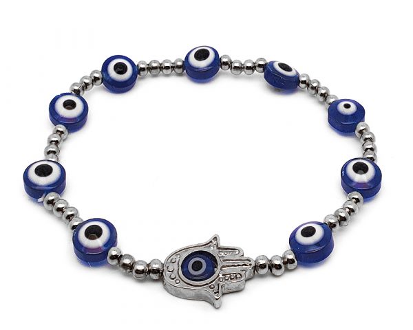 Handmade metal hamsa hand charm, evil eye bead, and seed bead stretchy bracelet in blue, silver, black, and white color combination.