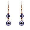Handmade double round evil eye bead dangle earrings with metal seed beads in blue, white, black, and gold color combination.