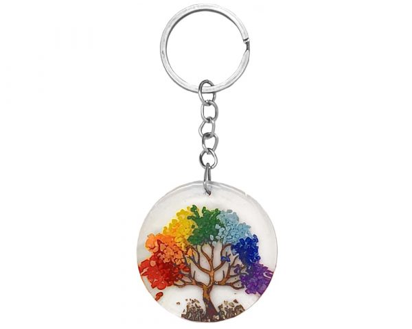Round clear acrylic resin, copper wire, and crushed chip stone inlay tree of life keychain on silver metal key ring in rainbow colors.