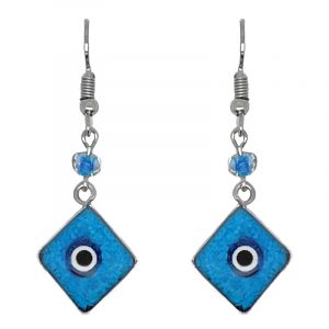 Handmade mini diamond-shaped resin and crushed chip stone inlay dangle earrings with round evil eye bead, alpaca silver metal setting, and beaded metal hooks in turquoise, blue, white, and black color combination.