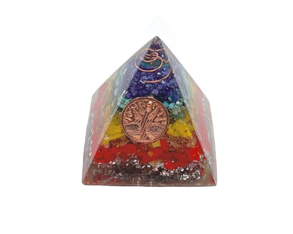Handmade acrylic resin, copper wire, and crushed chip stone inlay orgonite pyramid table ornament with 7 chakra rainbow striped pattern and round copper metal tree of life charm.