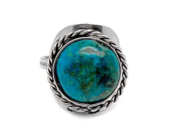 Handmade round-shaped semi-precious gemstone cabochon on adjustable alpaca silver metal ring with rope edge border in teal green chrysocolla.