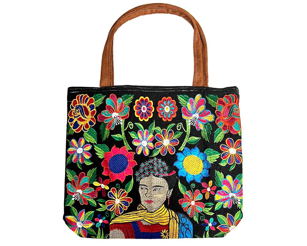 Handmade extra large tote purse bag with multicolored embroidered Frida inspired and floral designs and brown vegan leather suede handle in assorted colors. Color will vary from examples in image.