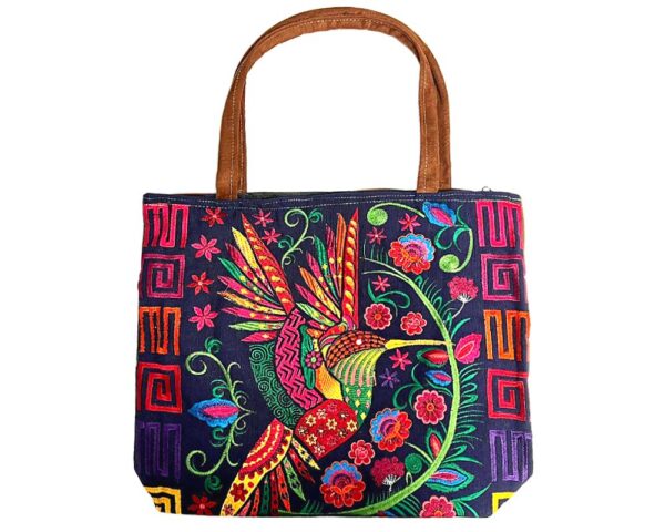 Handmade extra large tote purse bag with multicolored embroidered hummingbird and floral designs and brown vegan leather suede handle in assorted colors. Color will vary from examples in image.