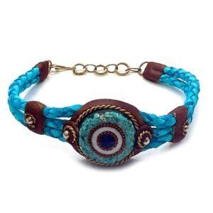 Braided dyed leather bracelet with brown resin, gold-colored metal, and round-shaped clear acrylic resin and crushed chip stone inlay evil eye centerpiece in turquoise blue color.