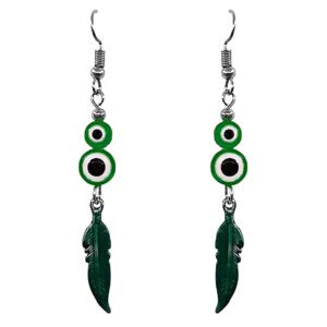 Handmade colored metal feather charm dangle earrings with double evil eye beads in green, white, and black color combination.