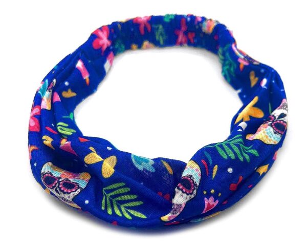Handmade soft cotton wrap headband with floral Day of the Dead sugar skull print pattern design in blue, white, and multicolored color combination.