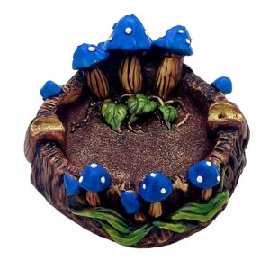 Handcrafted round incense holder ash tray with a 3D figurine of toadstool mushrooms and leaves in blue, white, brown, black, and gold color combination.